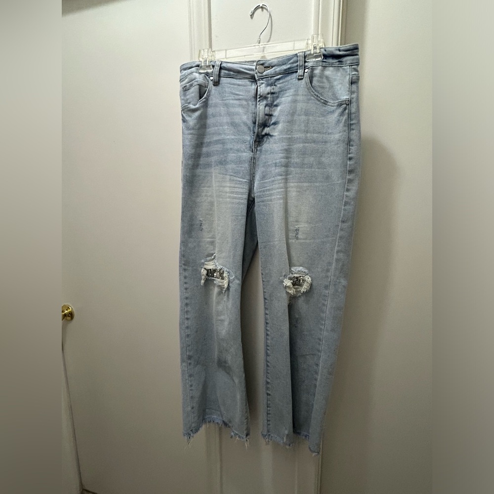 Risen high rise  sequined knees under the distressing.  Size 15. New never worn